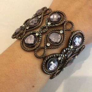 Brown/bronze base with purple gemstones